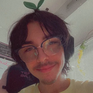 Noah, also known as Serieko, wearing glasses and a little sprout.